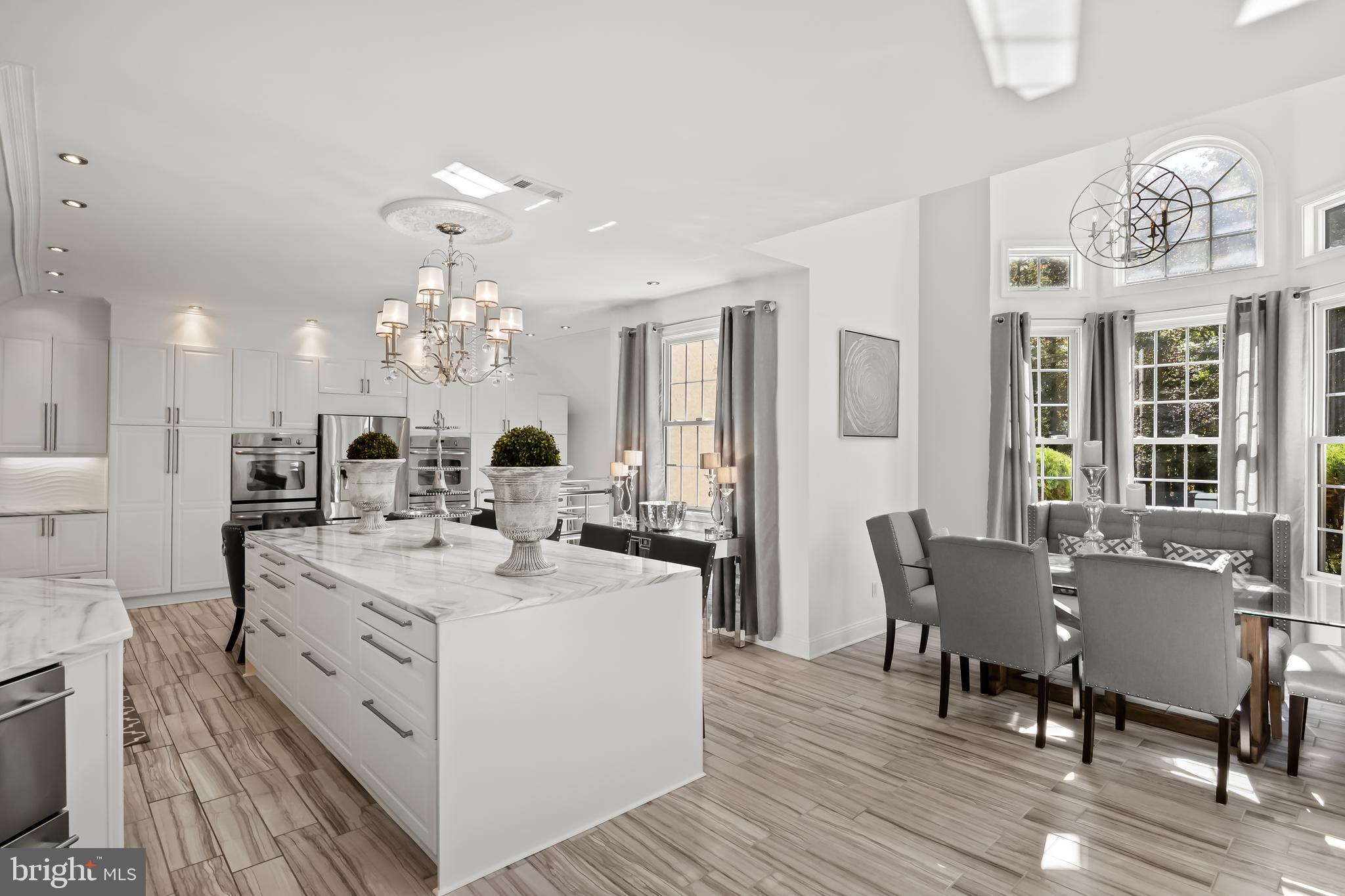 33 South Elmwood Road Marlton, NJ 08053 - Photo 29 of 98 a view of a dining room with furniture a chandelier and wooden floor