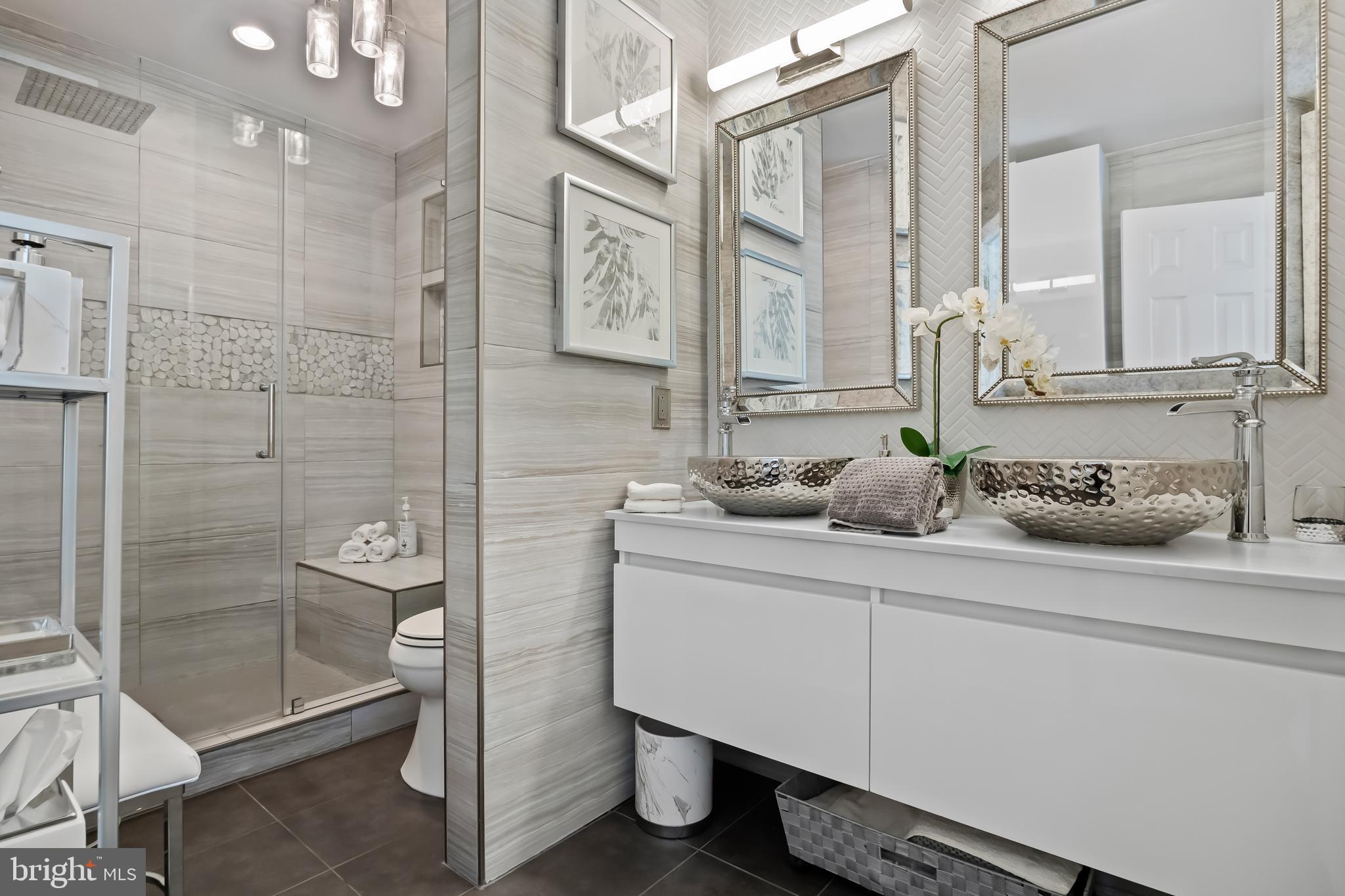 33 South Elmwood Road Marlton, NJ 08053 - Photo 53 of 98 a bathroom with a shower sink and mirror