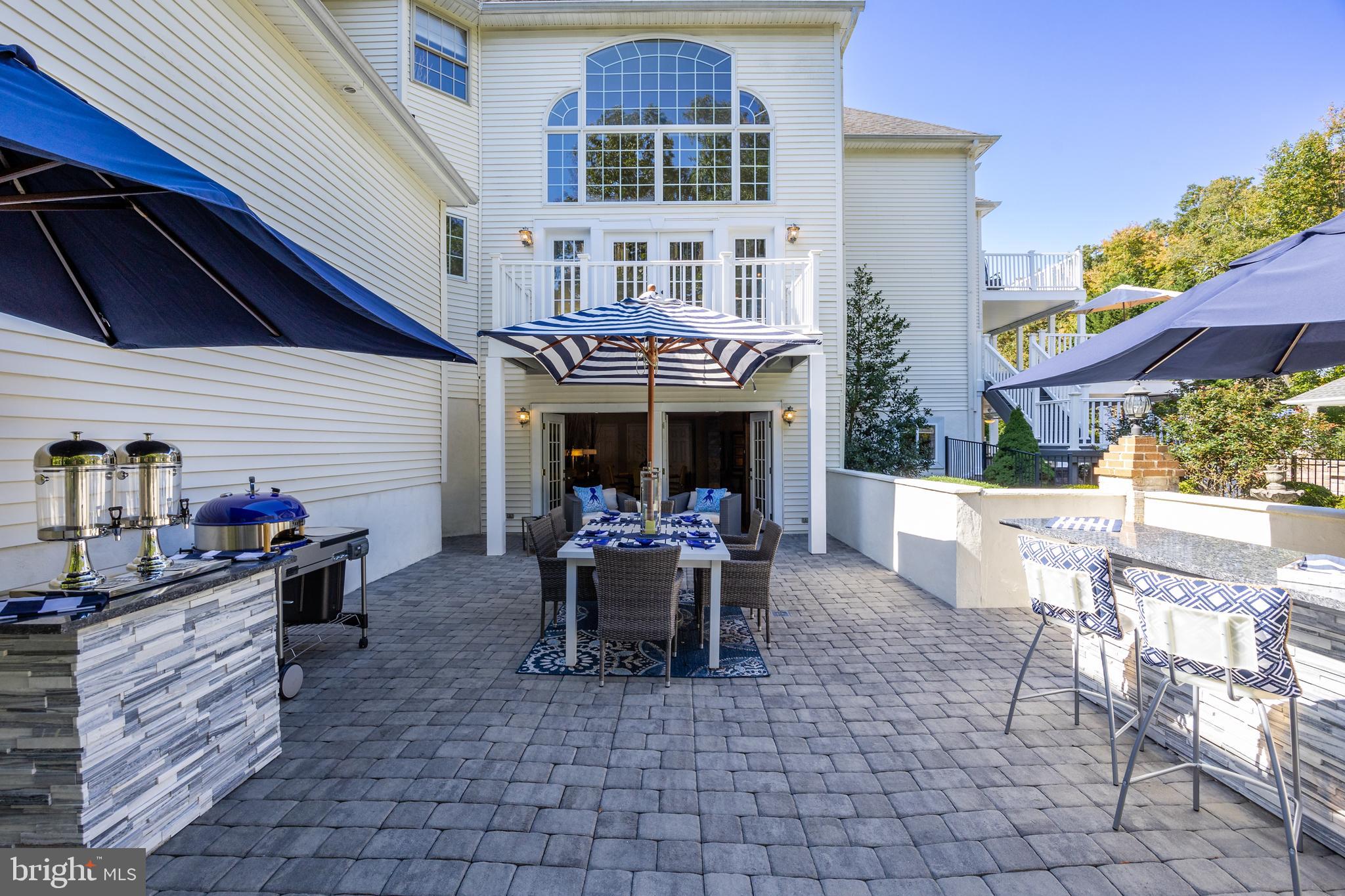 33 South Elmwood Road Marlton, NJ 08053 - Photo 72 of 98 a view of a patio with dining table and chairs