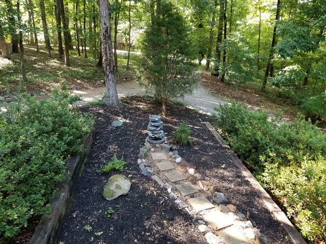 265 Bolingview Road Juliette, GA 31046 - Photo 18 of 21 a view of a backyard with plants and trees