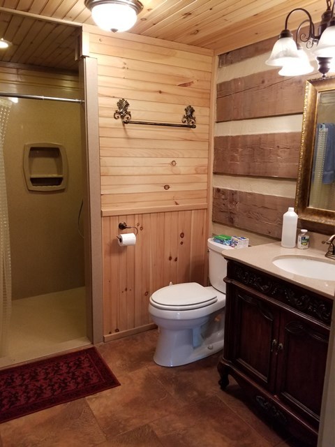 265 Bolingview Road Juliette, GA 31046 - Photo 7 of 21 a bathroom with a sink a toilet and shower