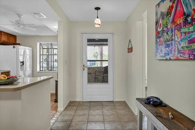 a hallway with a stove and a cabinet