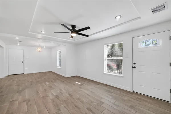 a view of room with a ceiling fan