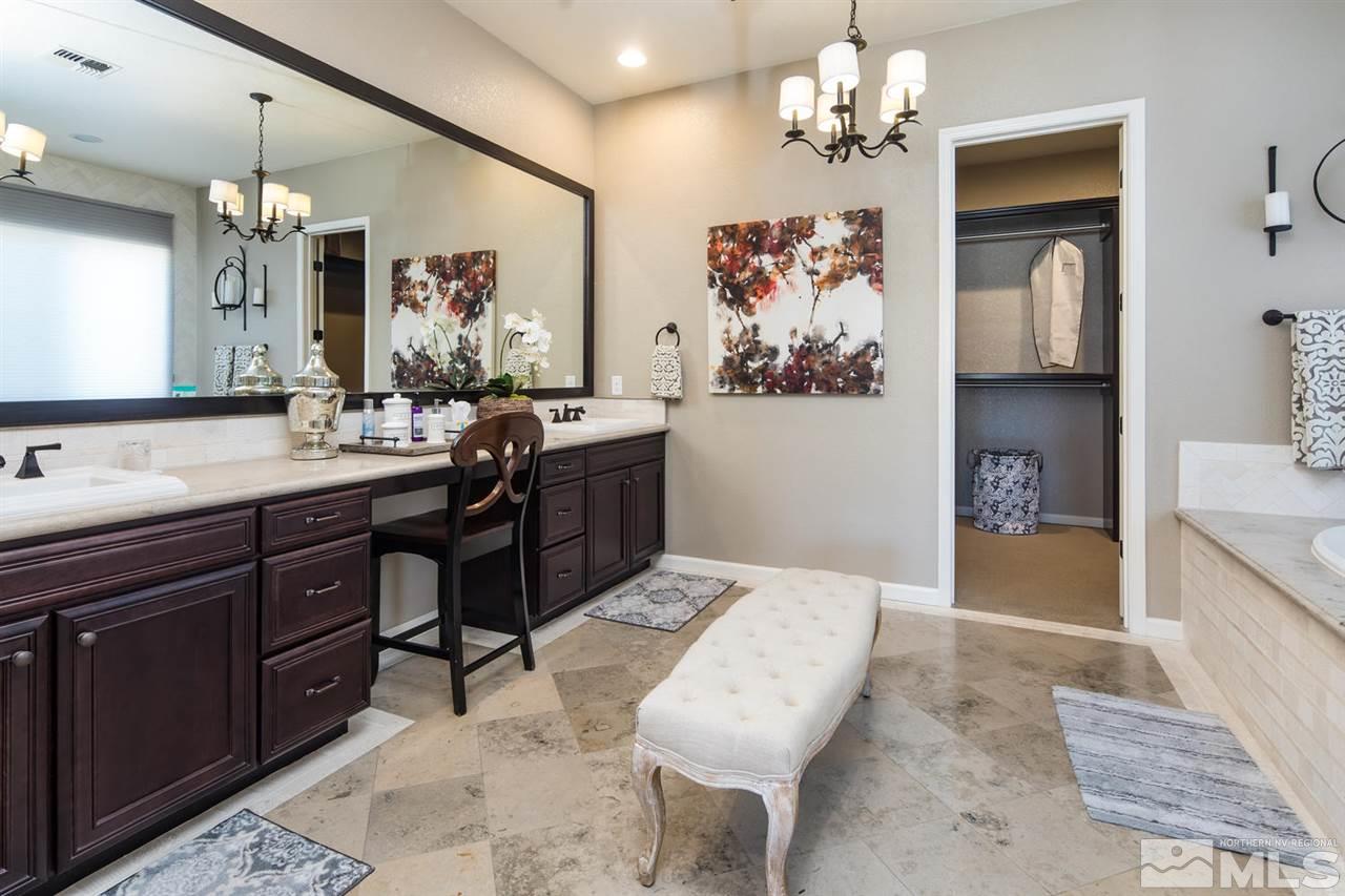2089 Altair Lane Reno, NV 89521 - Photo 17 of 25 a spacious bathroom with a granite countertop sink a mirror and a bathtub