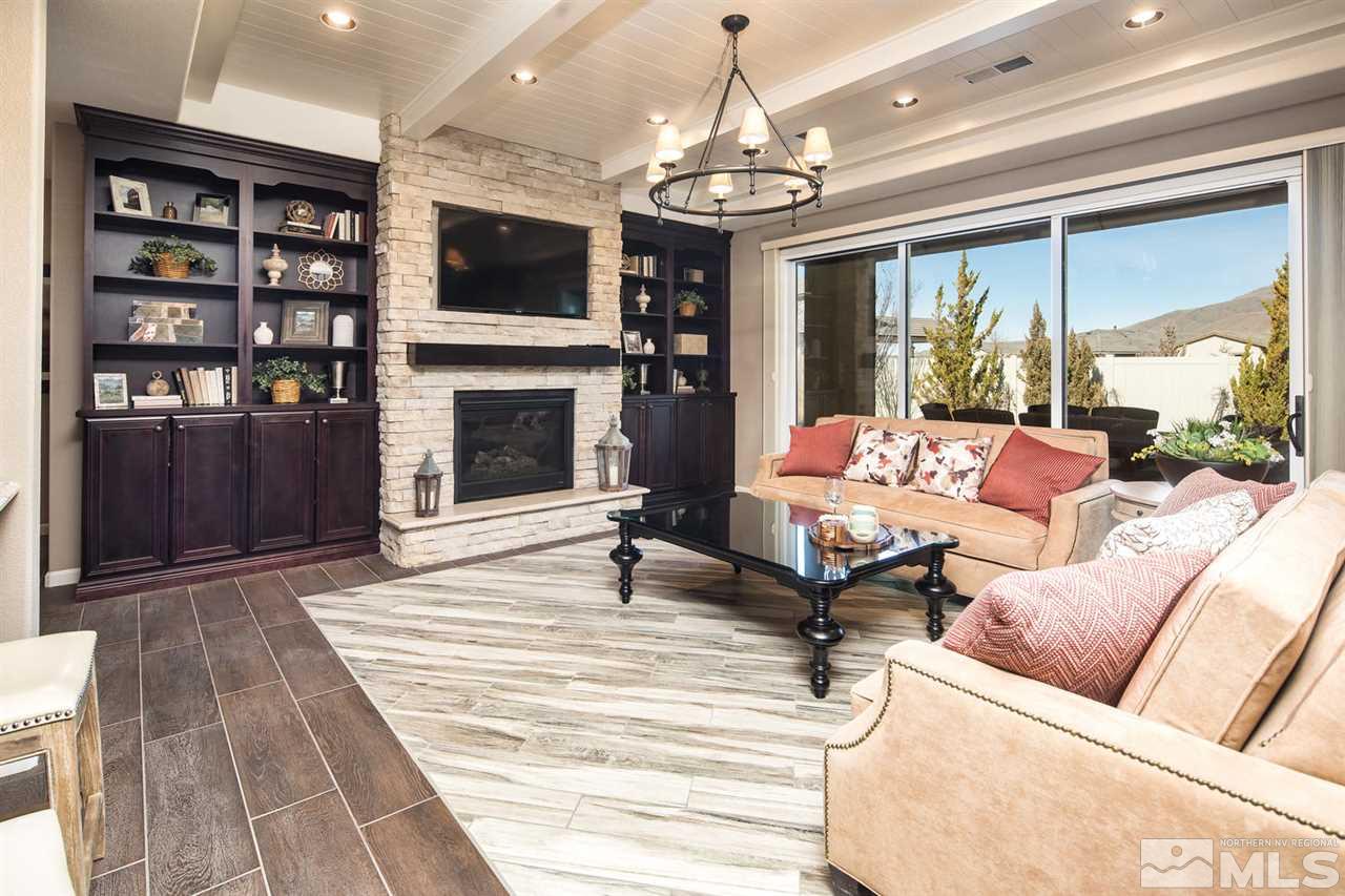2089 Altair Lane Reno, NV 89521 - Photo 10 of 25 a living room with furniture a fireplace and a flat screen tv