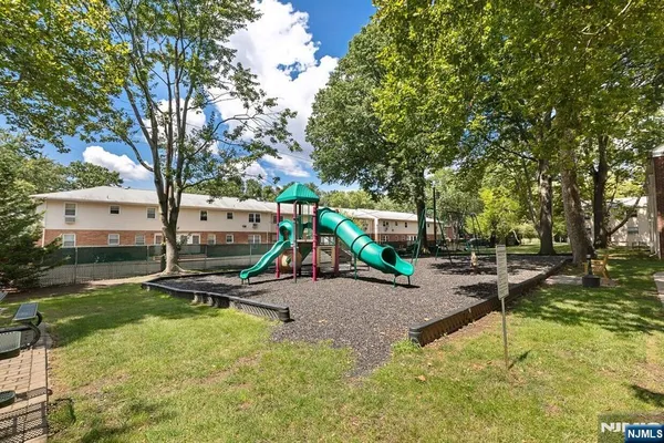 a view of a park with large trees