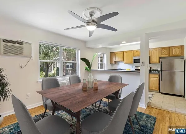 a dining room with furniture and window
