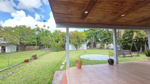 a view of a porch with furniture