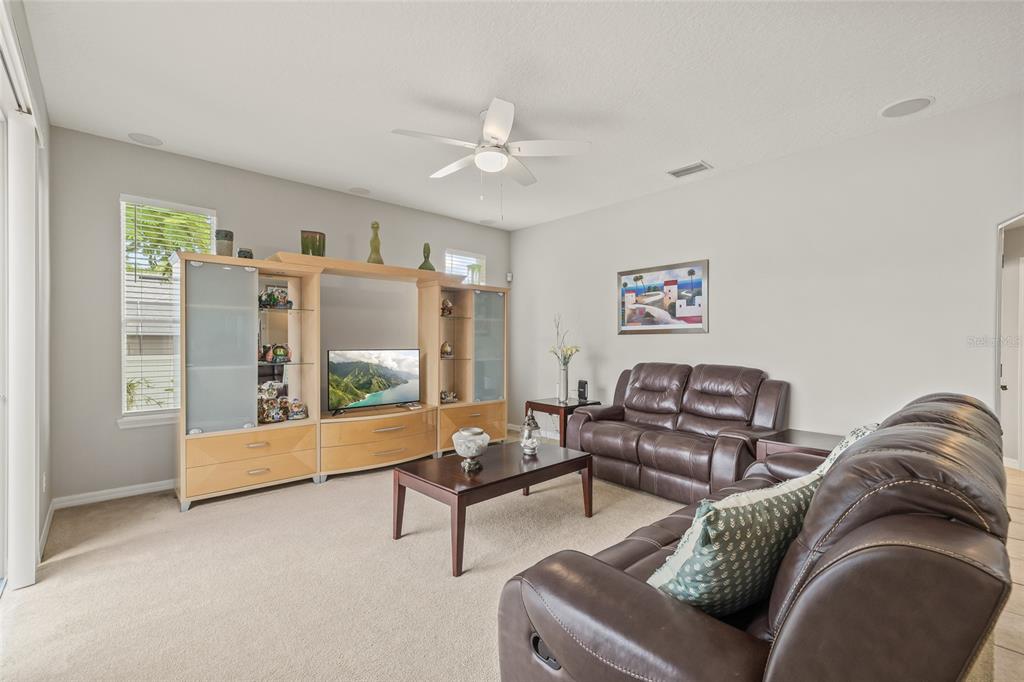 144 Costa Loop Auburndale, FL 33823 - Photo 15 of 34 a living room with furniture and a large window