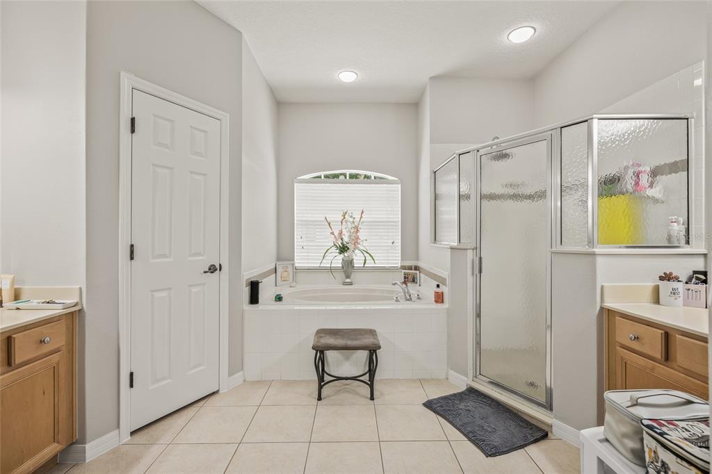 144 Costa Loop Auburndale, FL 33823 - Photo 17 of 34 a bathroom with a sink a toilet and shower