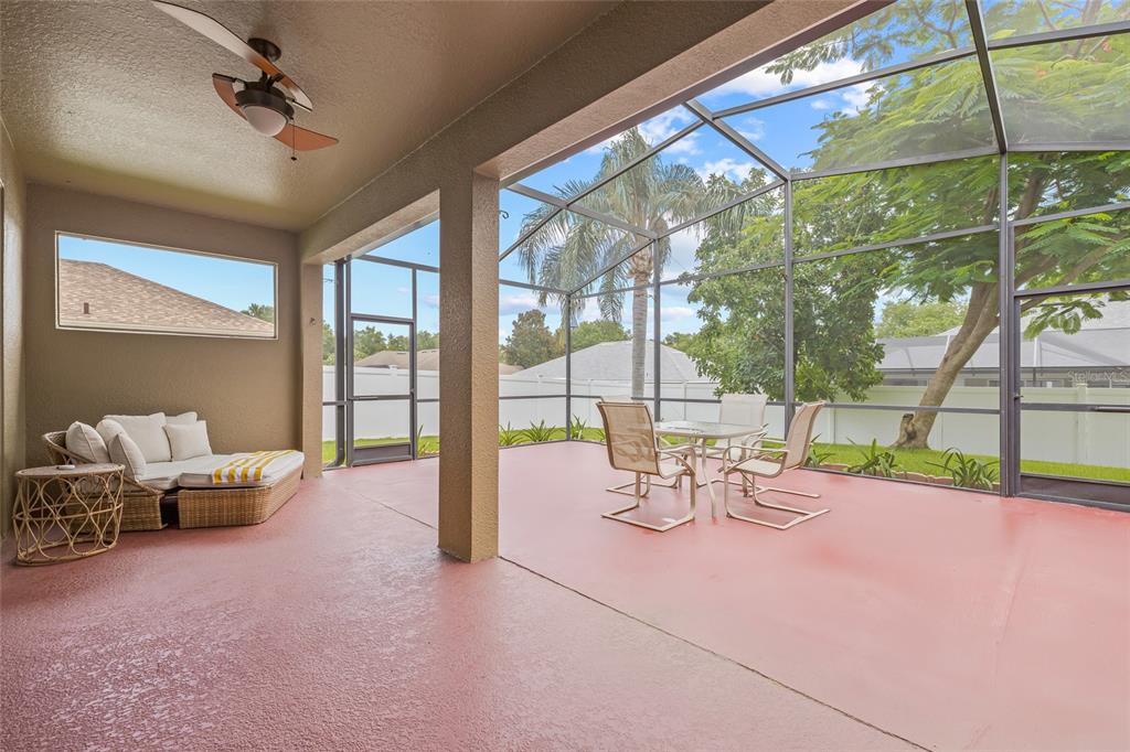 144 Costa Loop Auburndale, FL 33823 - Photo 19 of 34 a view of a room with gym equipment and floor to ceiling window