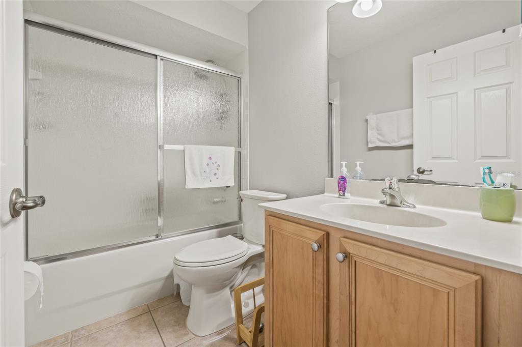 144 Costa Loop Auburndale, FL 33823 - Photo 21 of 34 a bathroom with a sink toilet and shower