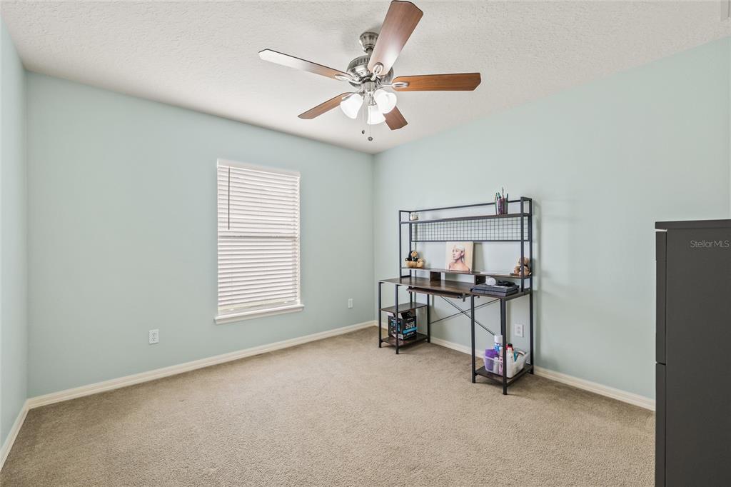 144 Costa Loop Auburndale, FL 33823 - Photo 22 of 34 a view of a livingroom with furniture and a ceiling fan
