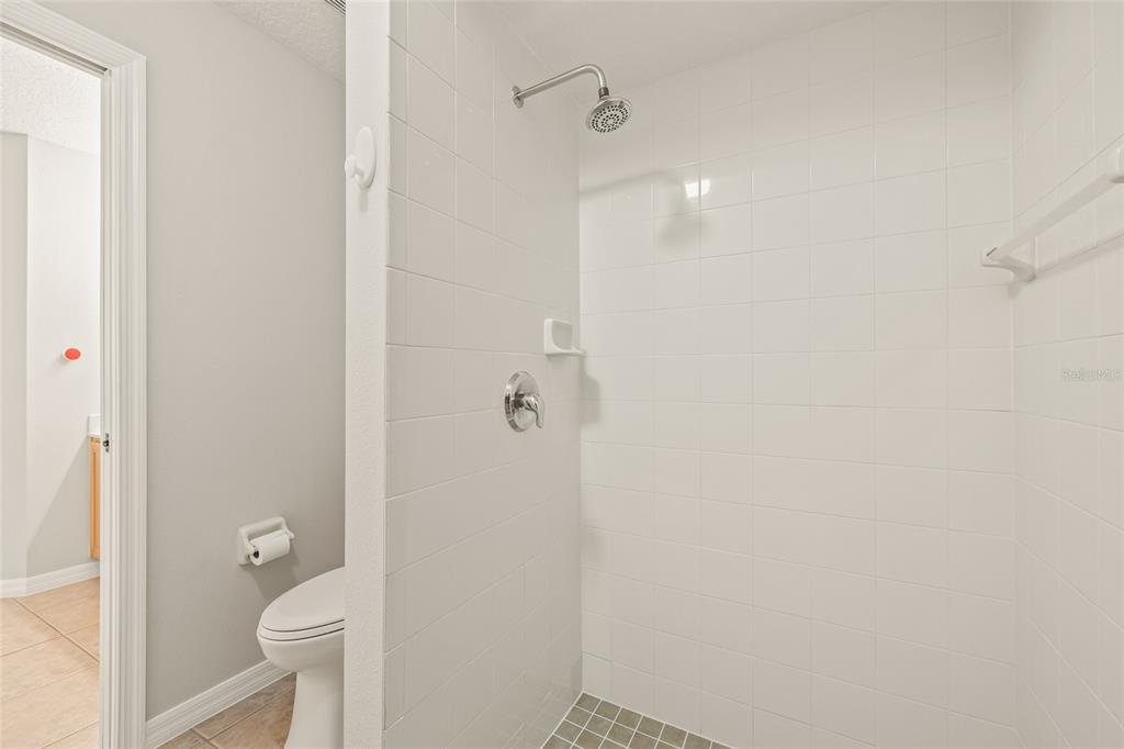 144 Costa Loop Auburndale, FL 33823 - Photo 24 of 34 a bathroom with a granite countertop shower and toilet