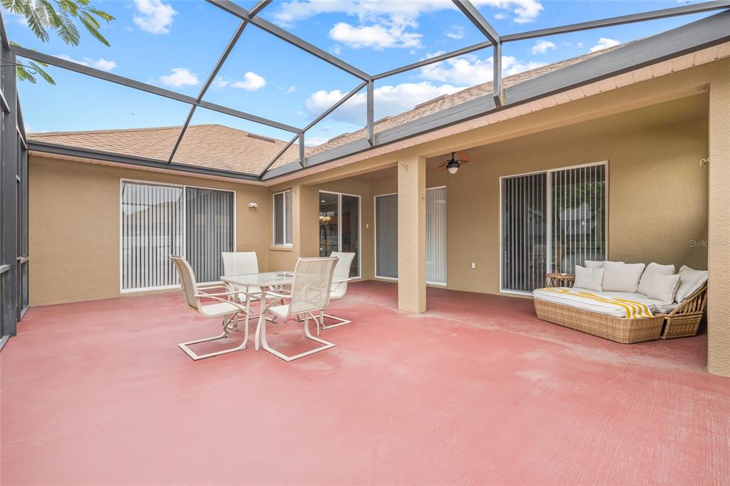 144 Costa Loop Auburndale, FL 33823 - Photo 26 of 34 a patio with a table and chairs