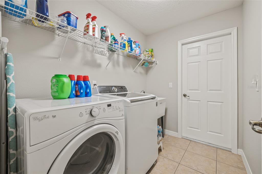 144 Costa Loop Auburndale, FL 33823 - Photo 27 of 34 a utility room with dryer and washer