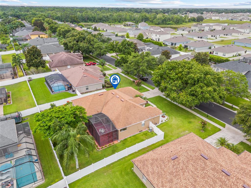 144 Costa Loop Auburndale, FL 33823 - Photo 30 of 34 an aerial view of a house with a swimming pool yard and outdoor seating