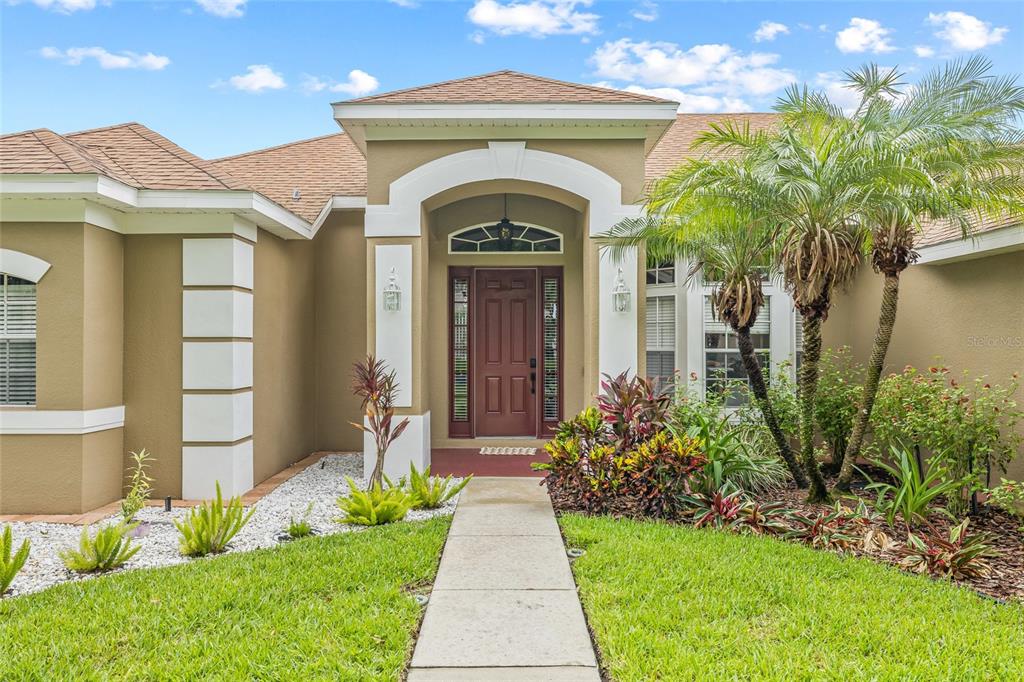 144 Costa Loop Auburndale, FL 33823 - Photo 34 of 34 a view of entrance of the house with a yard