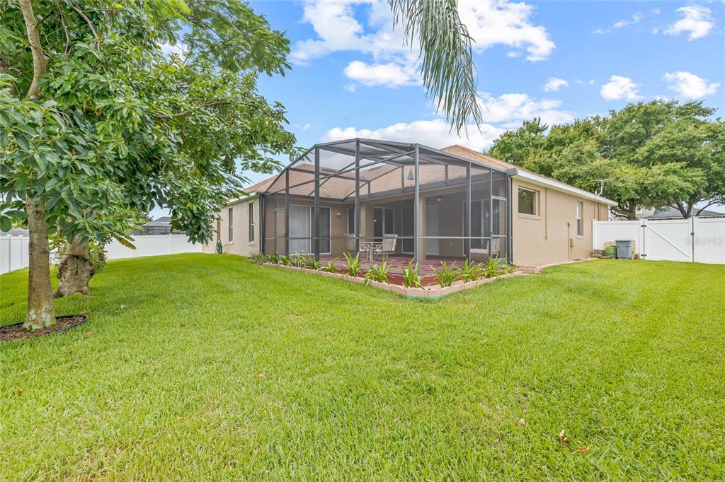 144 Costa Loop Auburndale, FL 33823 - Photo 5 of 34 a view of a house with backyard and sitting area