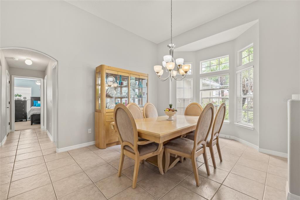 144 Costa Loop Auburndale, FL 33823 - Photo 9 of 34 a view of a dining room with furniture and window