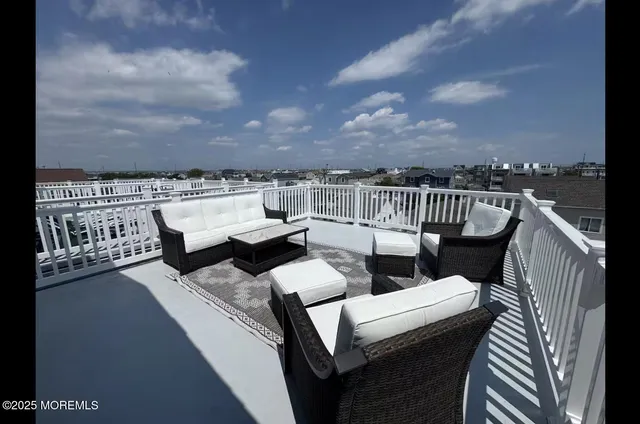 a view of a terrace with couches and potted plants