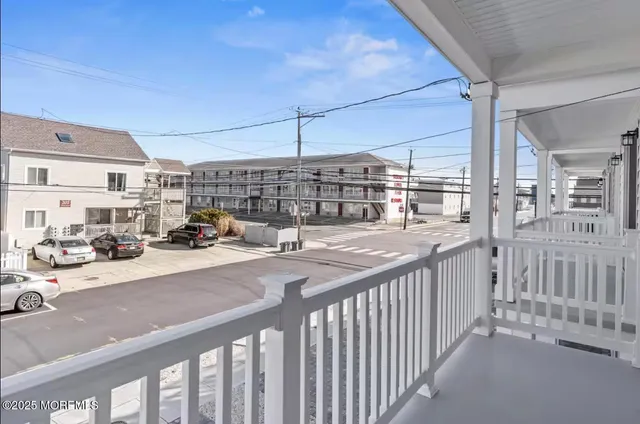 a view of a patio with a table and chairs