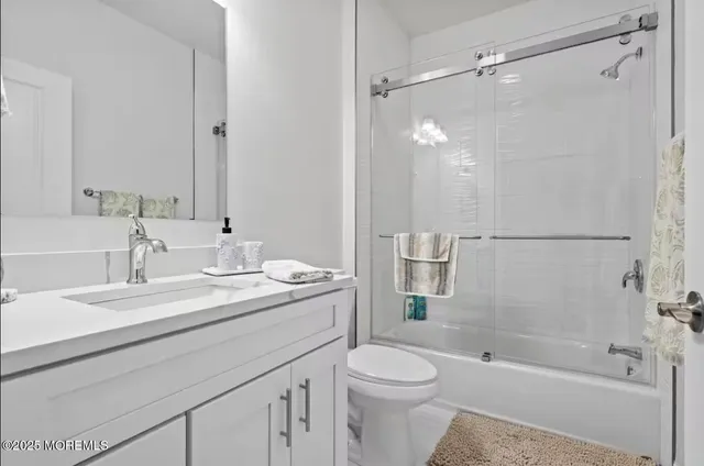 a bathroom with a double vanity sink mirror double shower and a bathtub