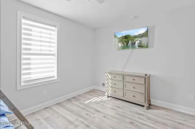 a room with a bed and a window