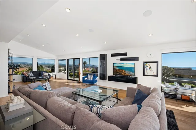 a kitchen with stainless steel appliances granite countertop a refrigerator a sink a stove and oven