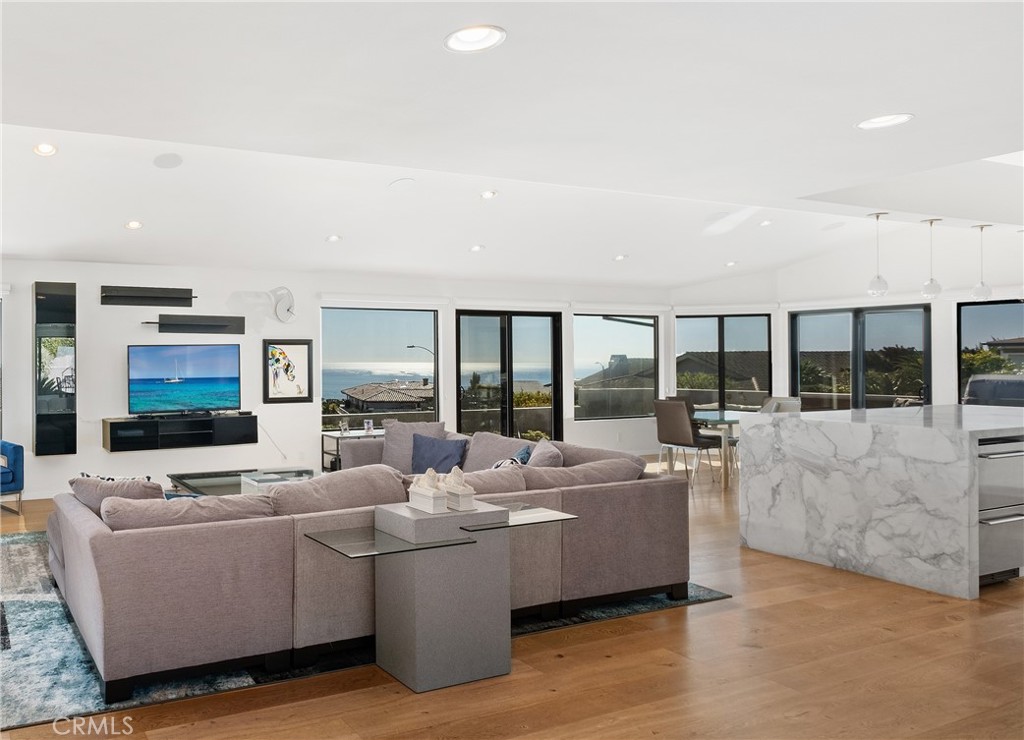 32182 Sea Island Drive Dana Point, CA 92629 - Photo 12 of 48 a living room with fireplace furniture and a flat screen tv