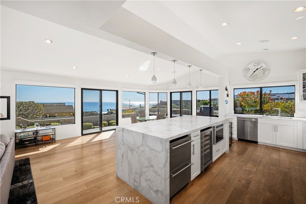 32182 Sea Island Drive Dana Point, CA 92629 - Photo 15 of 48 a large white kitchen with a large window
