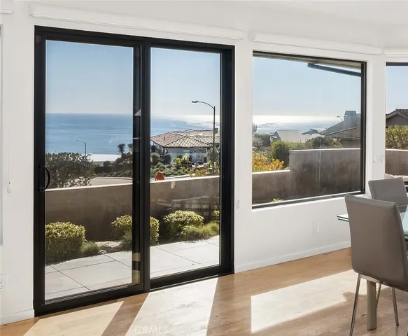 a kitchen with stainless steel appliances kitchen island granite countertop a sink refrigerator and cabinets