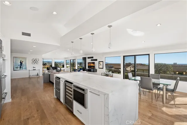 a bedroom with a bed and large windows