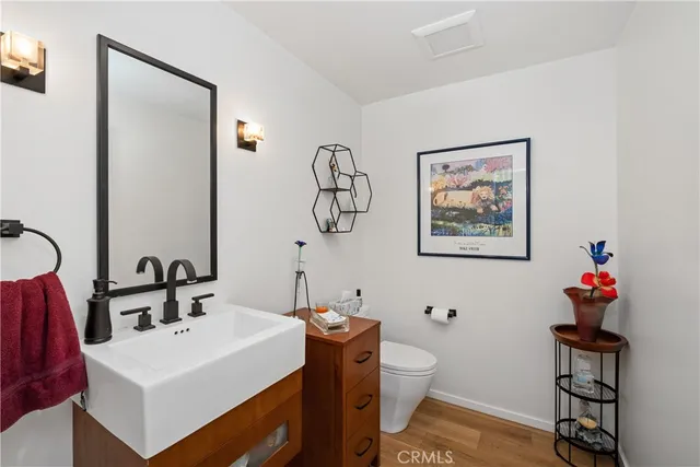 a spacious bathroom with a large mirror vanity and a shower