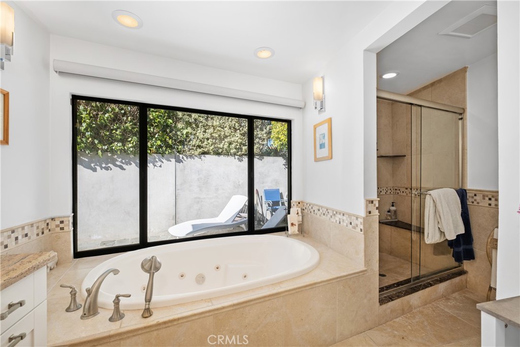 32182 Sea Island Drive Dana Point, CA 92629 - Photo 27 of 48 a bathroom with a bathtub and a window