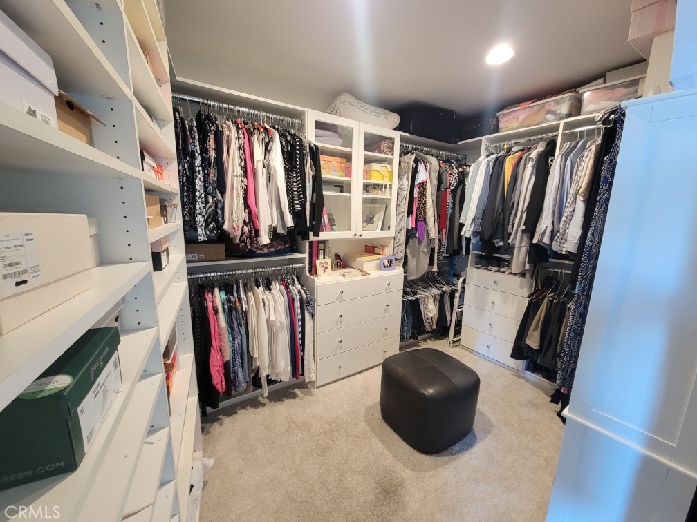 32182 Sea Island Drive Dana Point, CA 92629 - Photo 28 of 48 a view of walk in closet with clothes and shoes