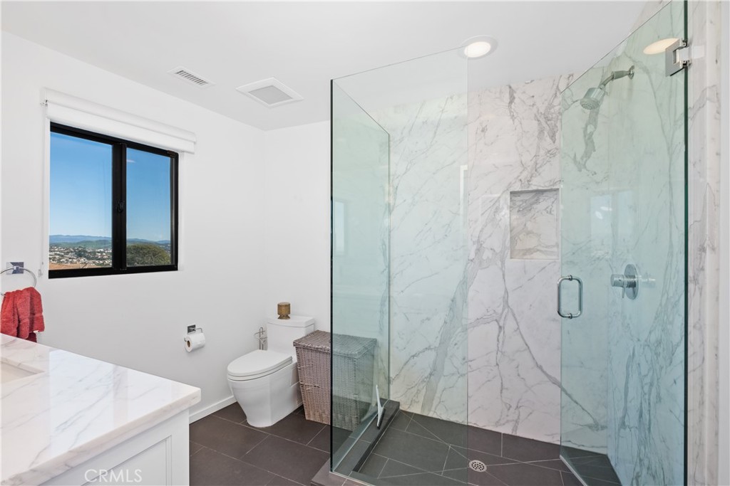 32182 Sea Island Drive Dana Point, CA 92629 - Photo 31 of 48 a bathroom with a shower toilet and sink