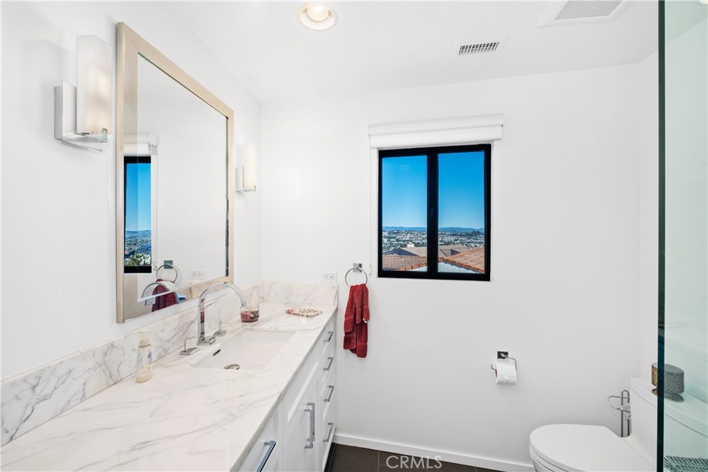 32182 Sea Island Drive Dana Point, CA 92629 - Photo 32 of 48 a bathroom with a sink and a mirror
