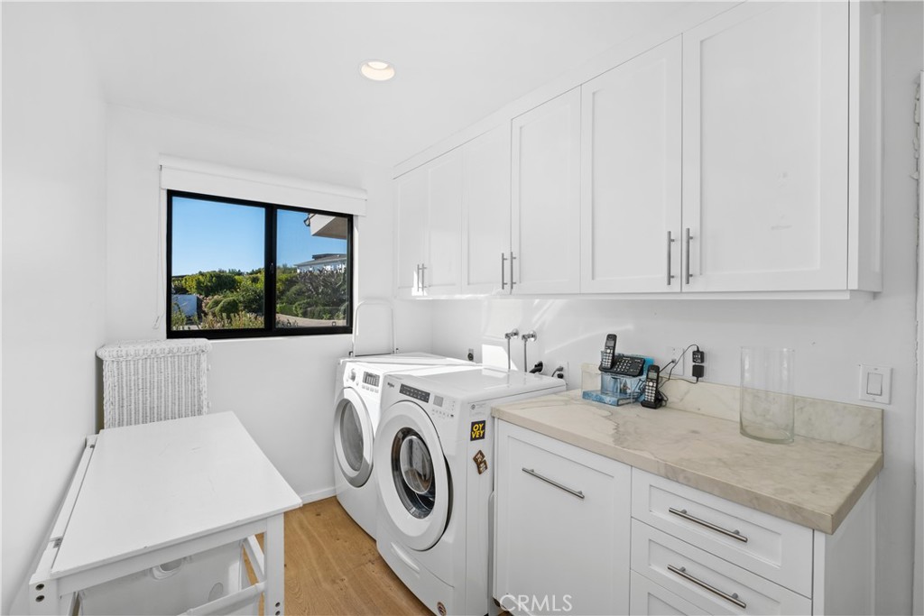 32182 Sea Island Drive Dana Point, CA 92629 - Photo 33 of 48 a utility room with sink dryer and washer