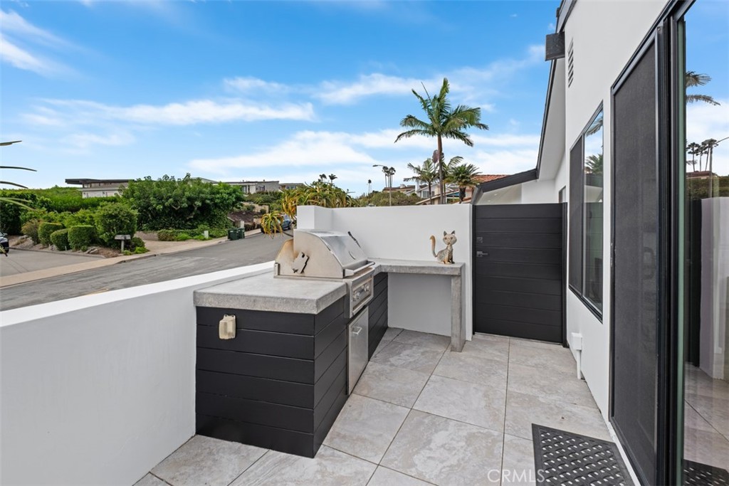 32182 Sea Island Drive Dana Point, CA 92629 - Photo 34 of 48 a view of a kitchen with a sink and dishwasher
