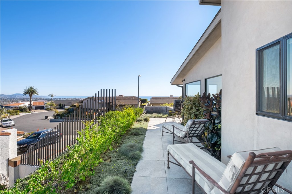 32182 Sea Island Drive Dana Point, CA 92629 - Photo 43 of 48 a view of a patio with couches table and chairs and potted plants