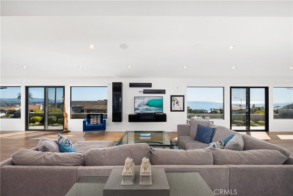 32182 Sea Island Drive Dana Point, CA 92629 - Photo 10 of 48 a living room with furniture and a flat screen tv