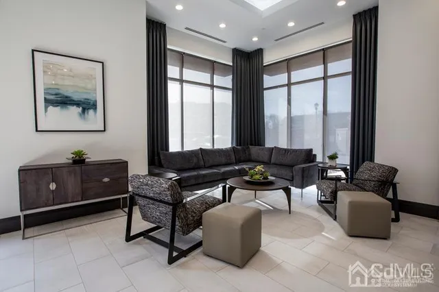 a living room with furniture and a window