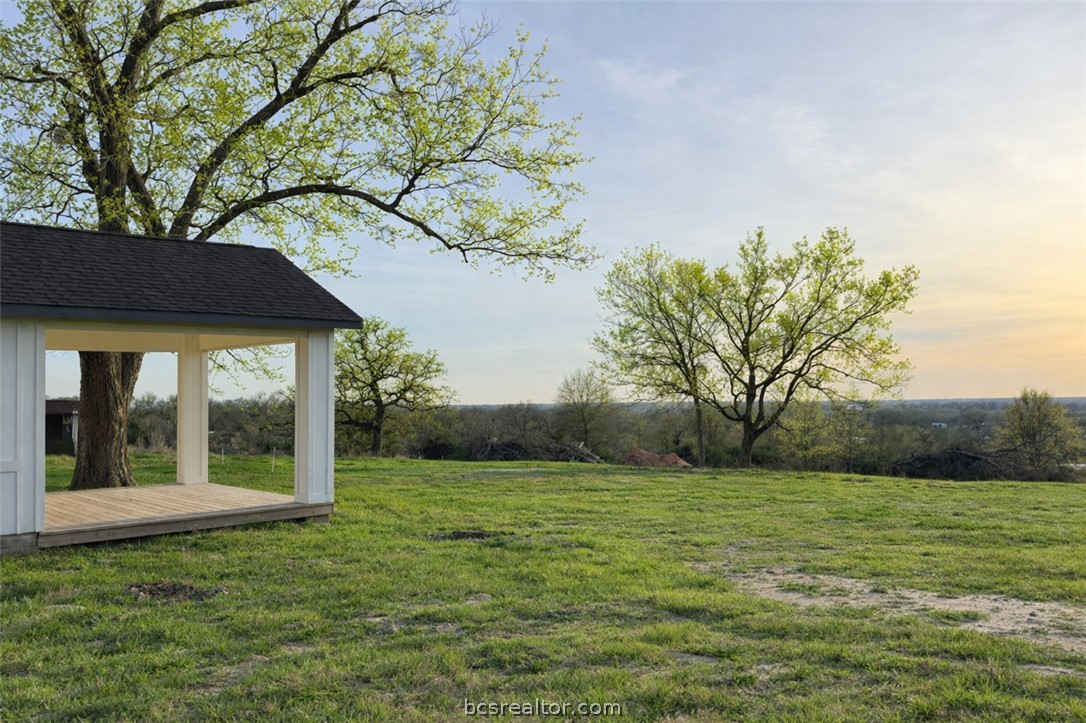 3917 Harbor Bolton Road Franklin, TX 77856 - Photo 2 of 26 a view of a backyard with a garden