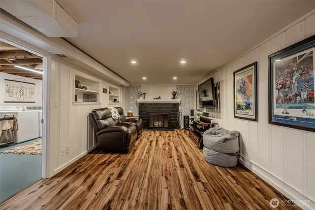 a living room with furniture and a fireplace