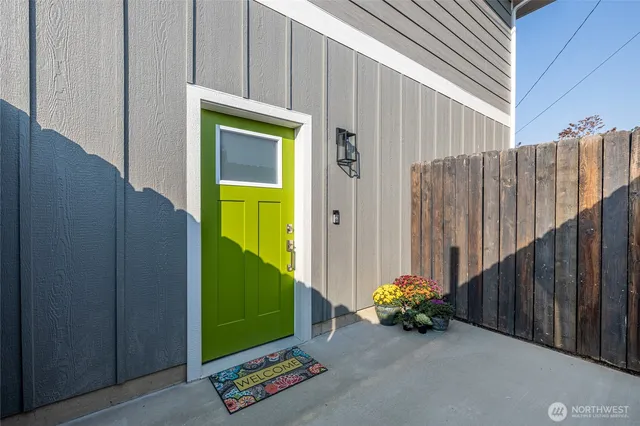 a backyard of a house with table and chairs