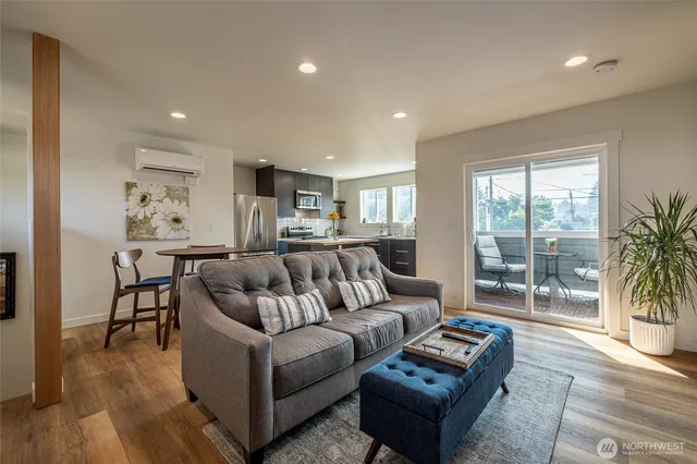 a living room with furniture and a large window