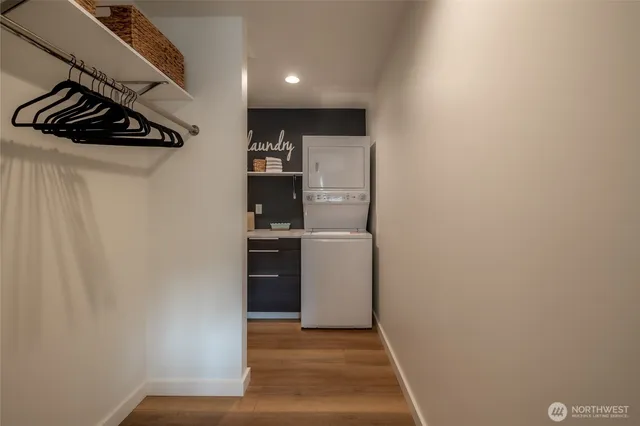 a kitchen with a refrigerator and a stove top oven
