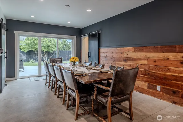 a view of a dining room with furniture window and outside view