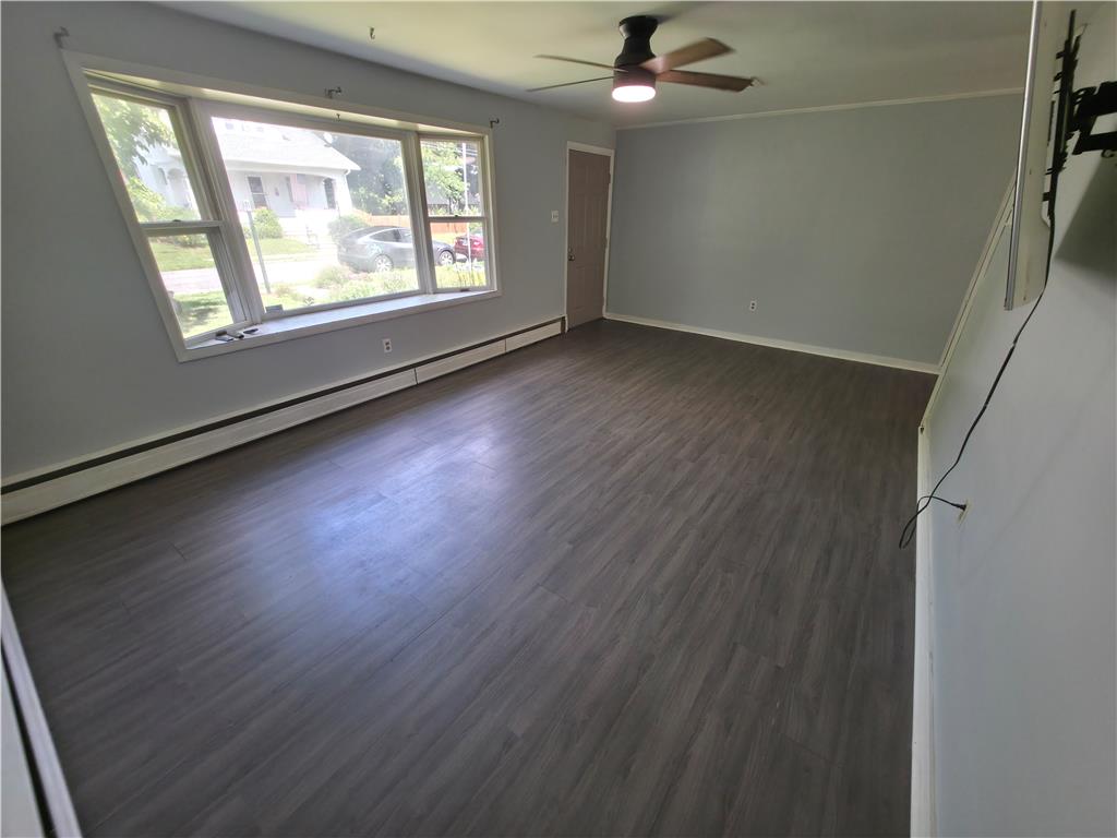 719 Keystone Avenue Bethlehem, PA 18018 - Photo 7 of 32 A bay window illuminates this spacious living room, featuring durable wood-look flooring.